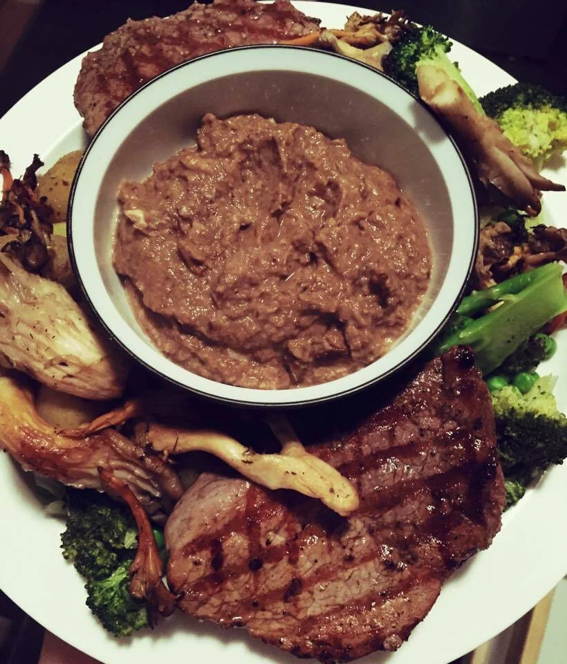 Beef steak with mushroom sauce and spring vegetables