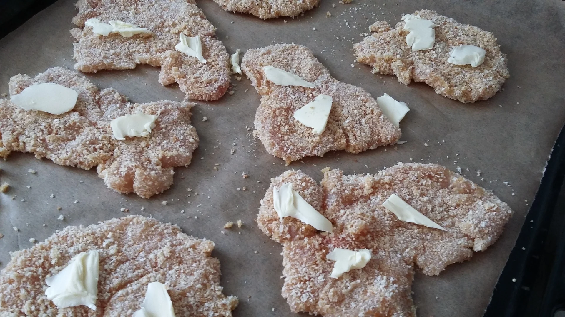 Breaded chicken breast schnitzels with baked potato side dish