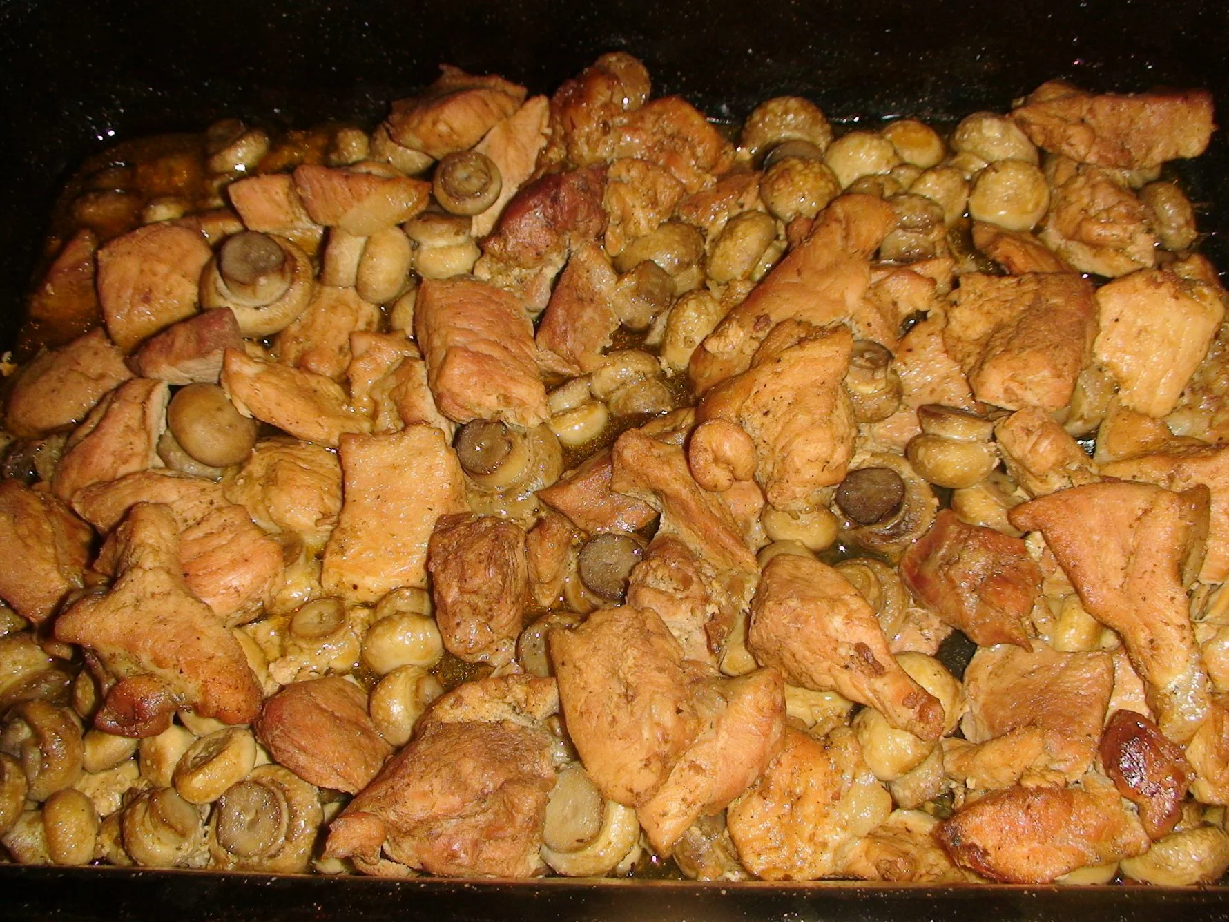 Pork chop with mushrooms in the oven