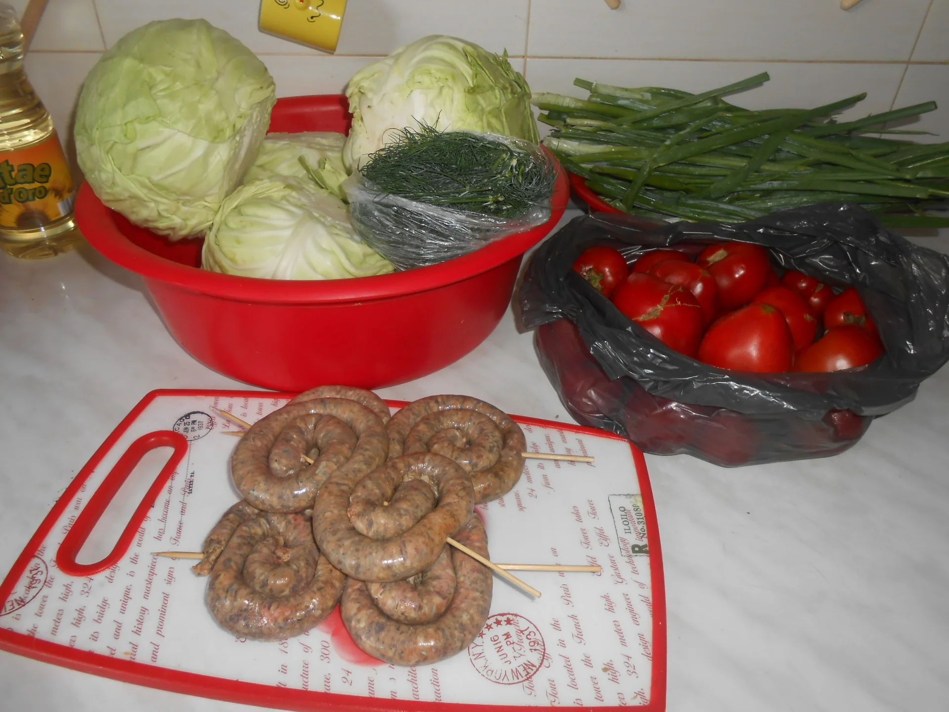Cabbage with tomatoes and green onions and Plescoi sausages