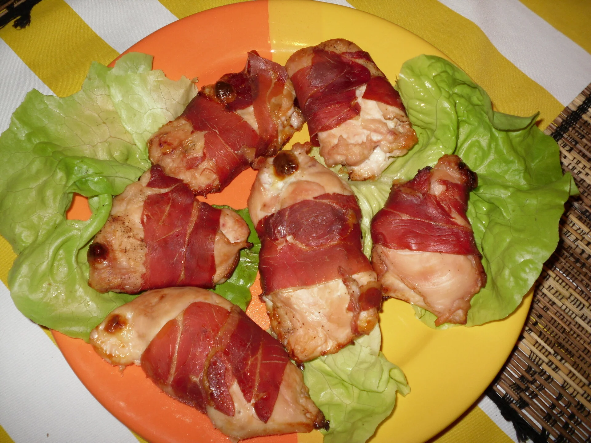 Chicken breast rolls wrapped in prosciutto