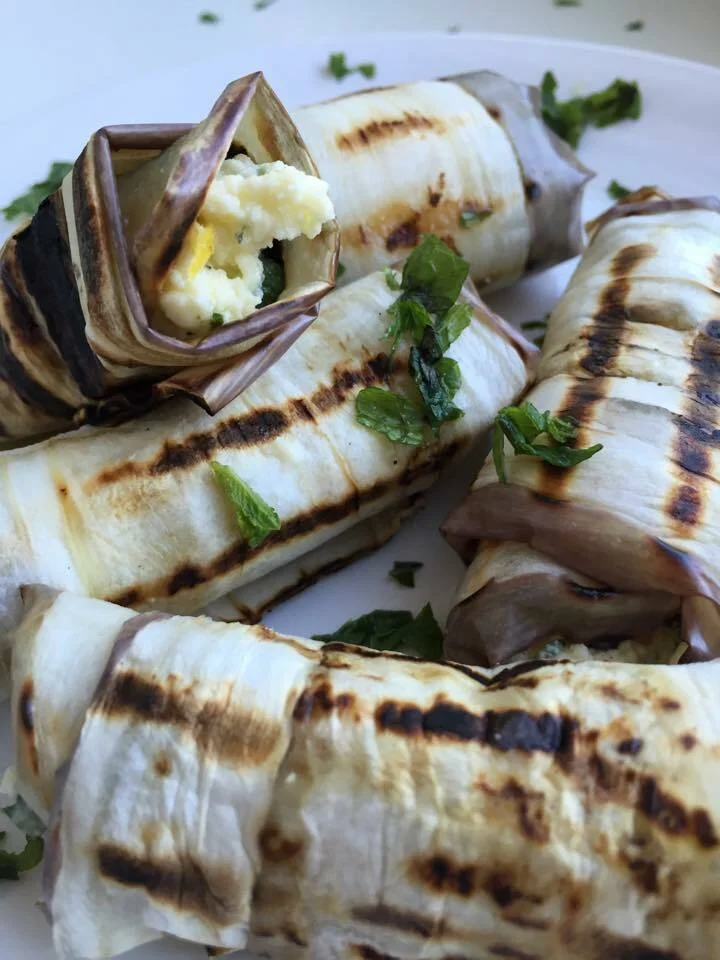 Eggplant rolls stuffed with Feta cheese, chili, and mint