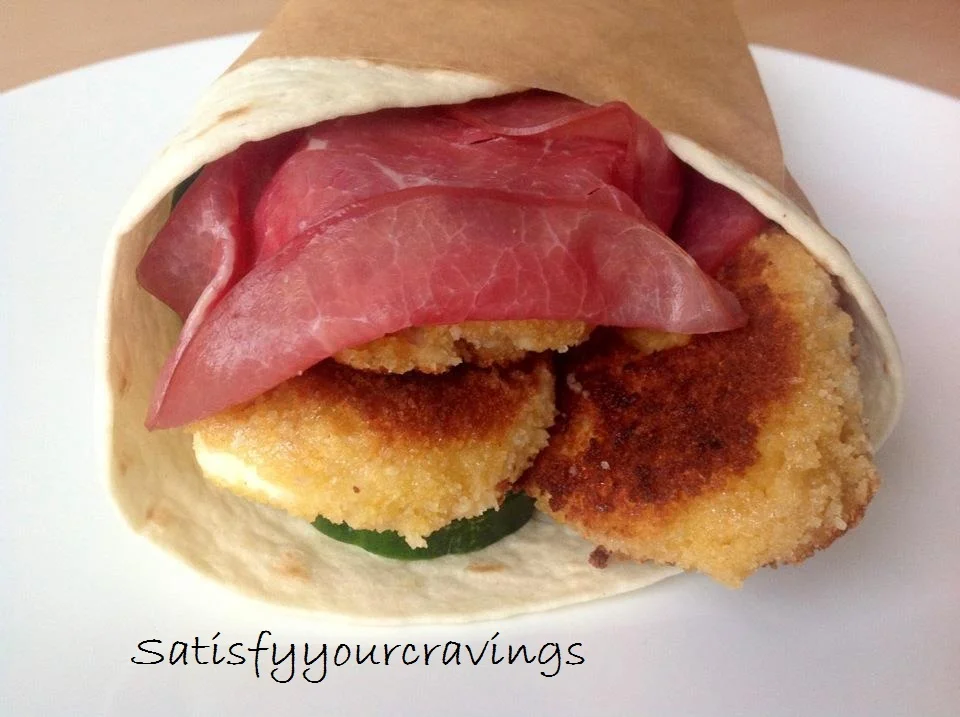 Tortilla wraps with breaded Mozzarella and smoked pastrami