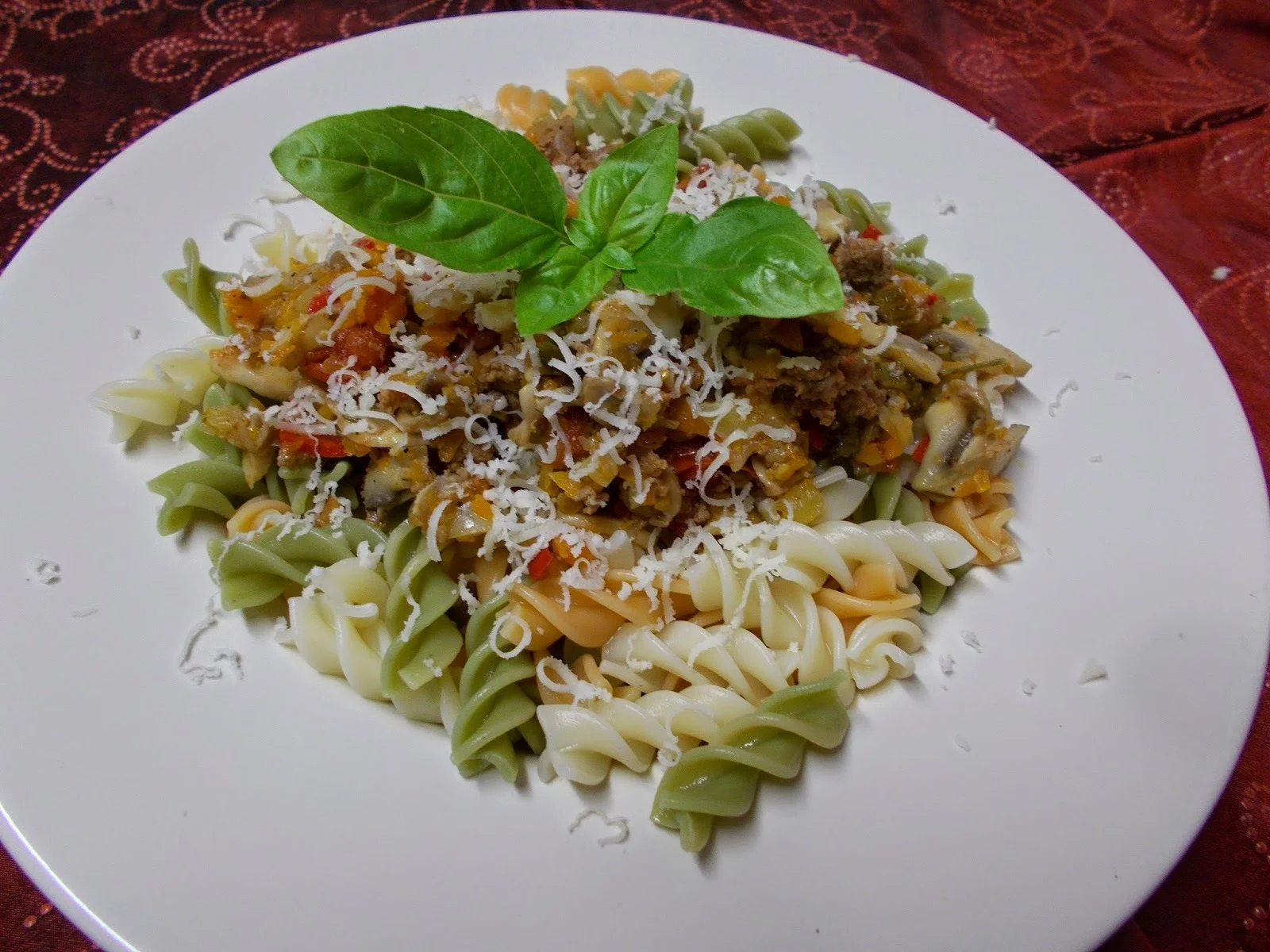 Colored fusilli with ragù