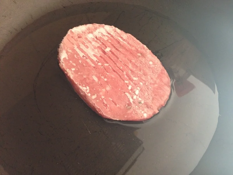 Turkey burger sandwich with mushrooms and tomatoes