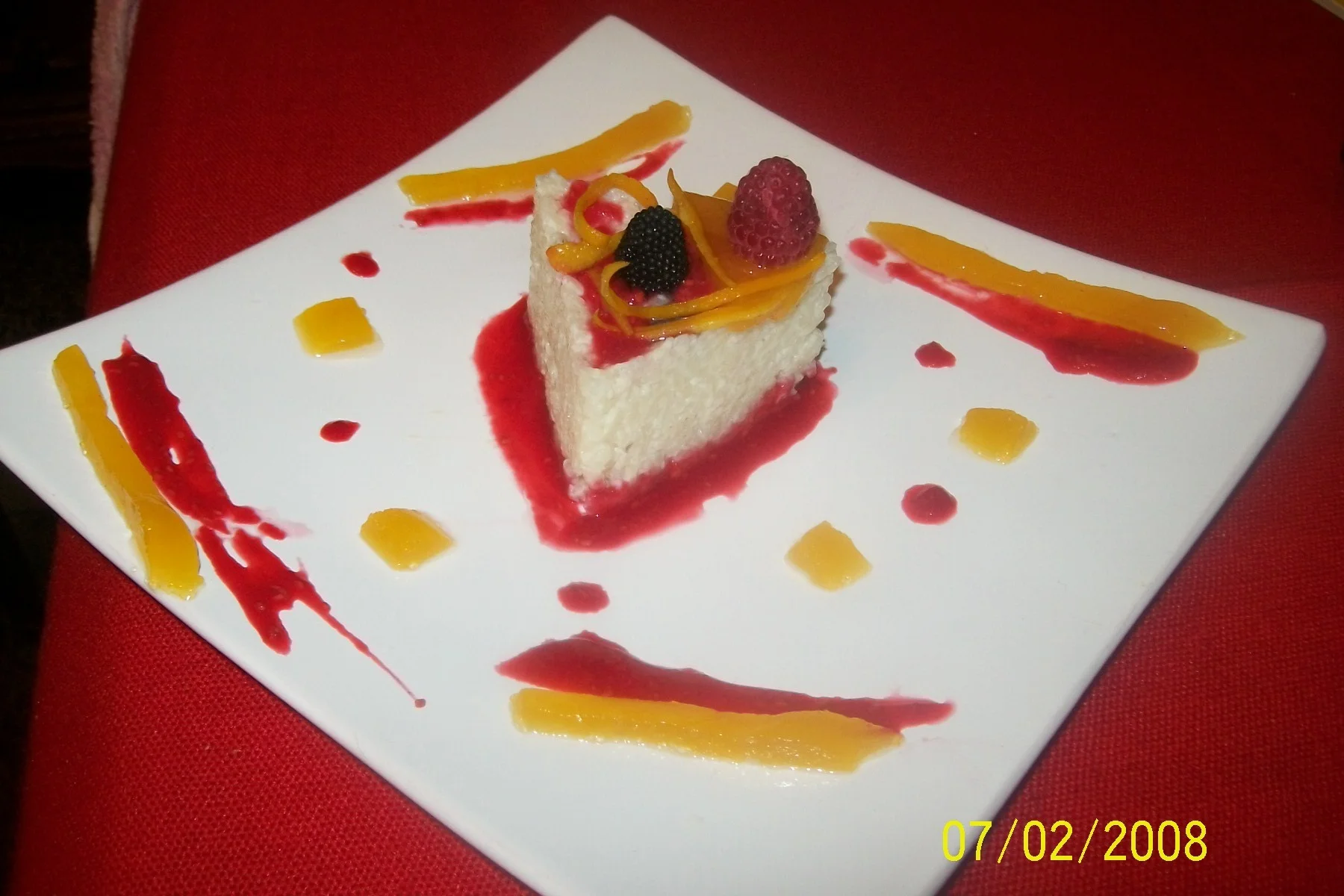 Rice pudding with orange jelly and raspberry dressing