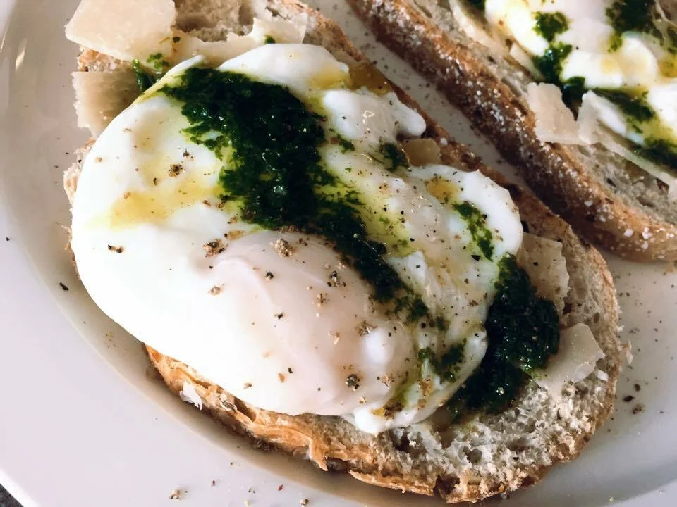 Toast with Parmesan flakes, poached egg, and Pistou