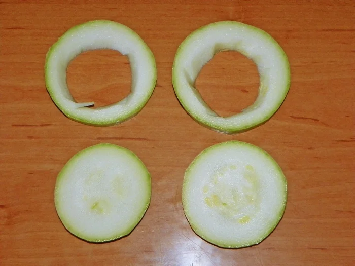 Zucchini rounds stuffed with minced meat, breaded