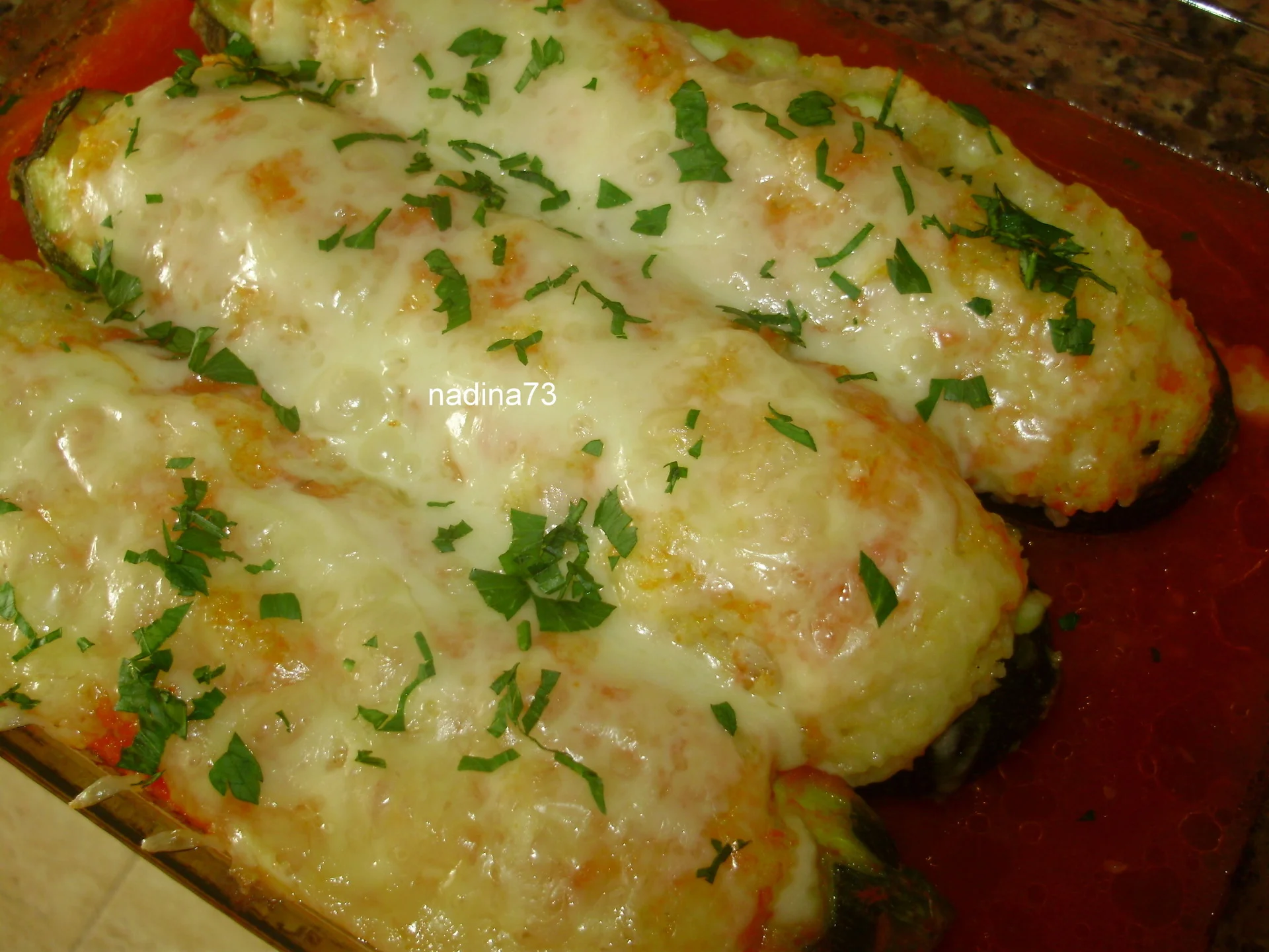 Zucchini stuffed with couscous and cheese